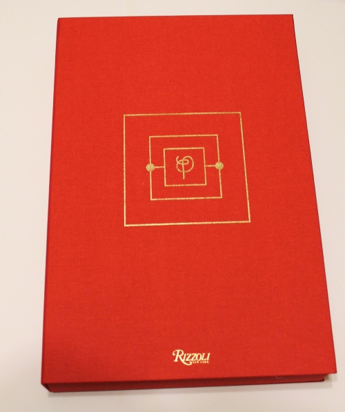 The deluxe edition clamshell case, covered in red bookcloth with gold foil-stamping.
